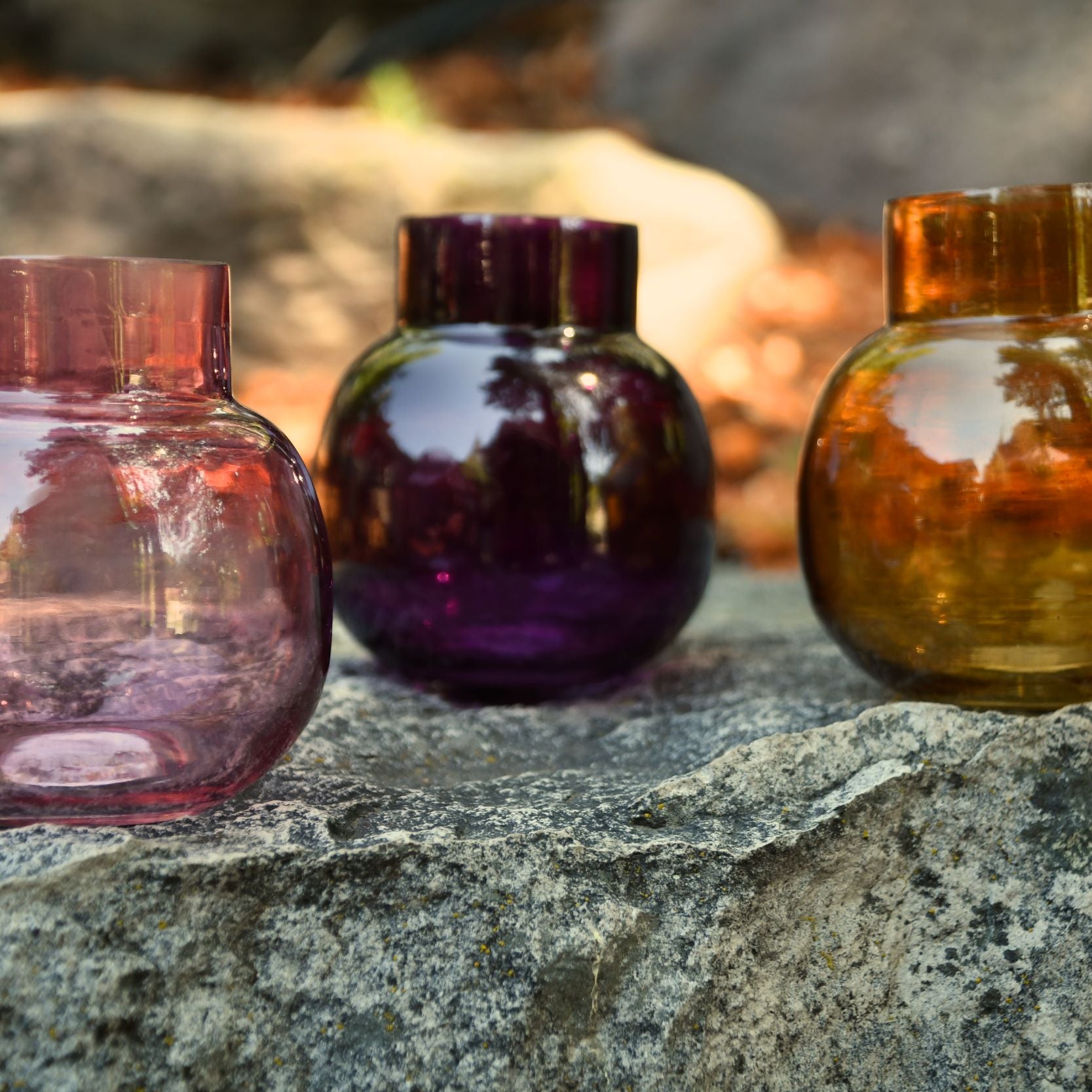 Small glass bud vase. Purple, amber or pink.