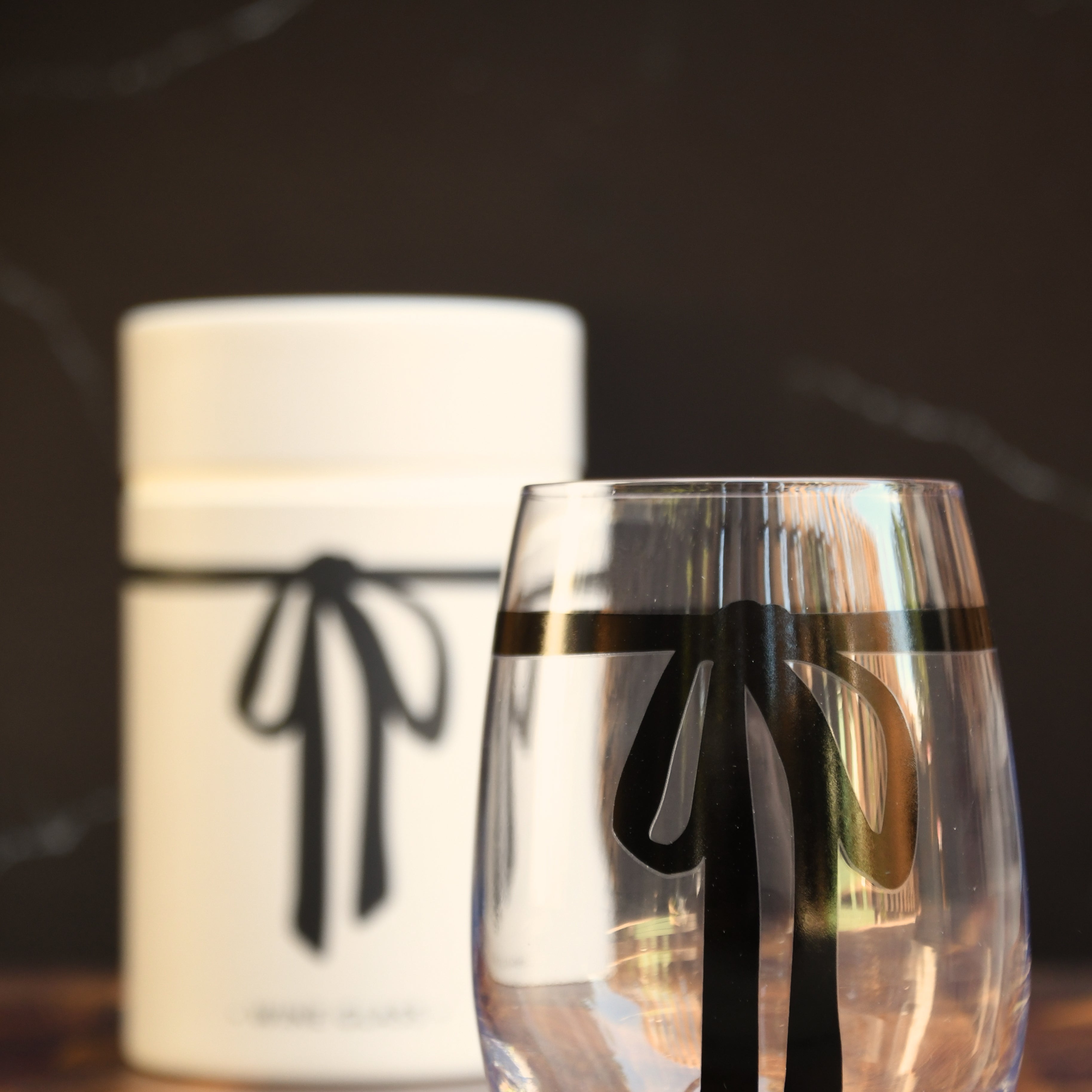 17 oz stemless wine glass with black bow.