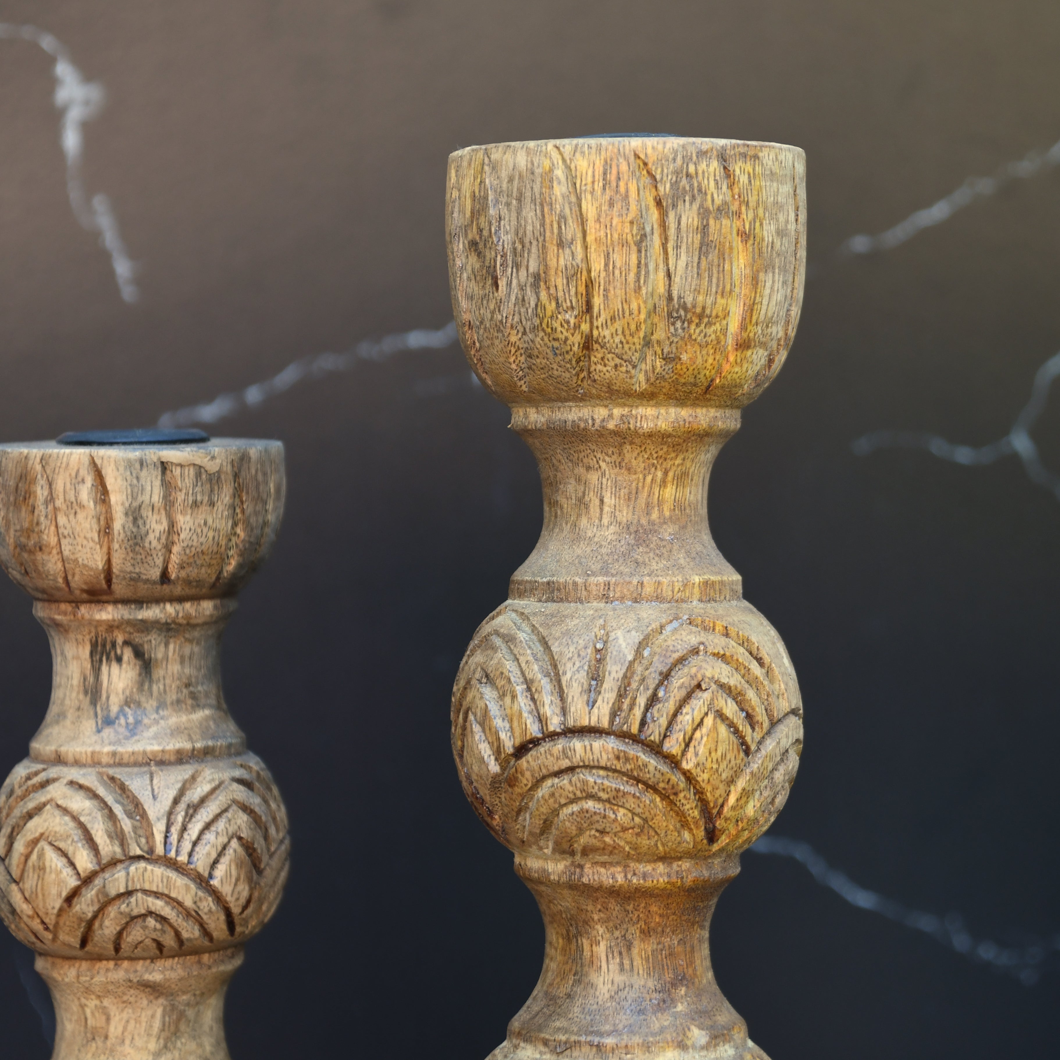 Wooden candle holder hand carved out of mango wood.