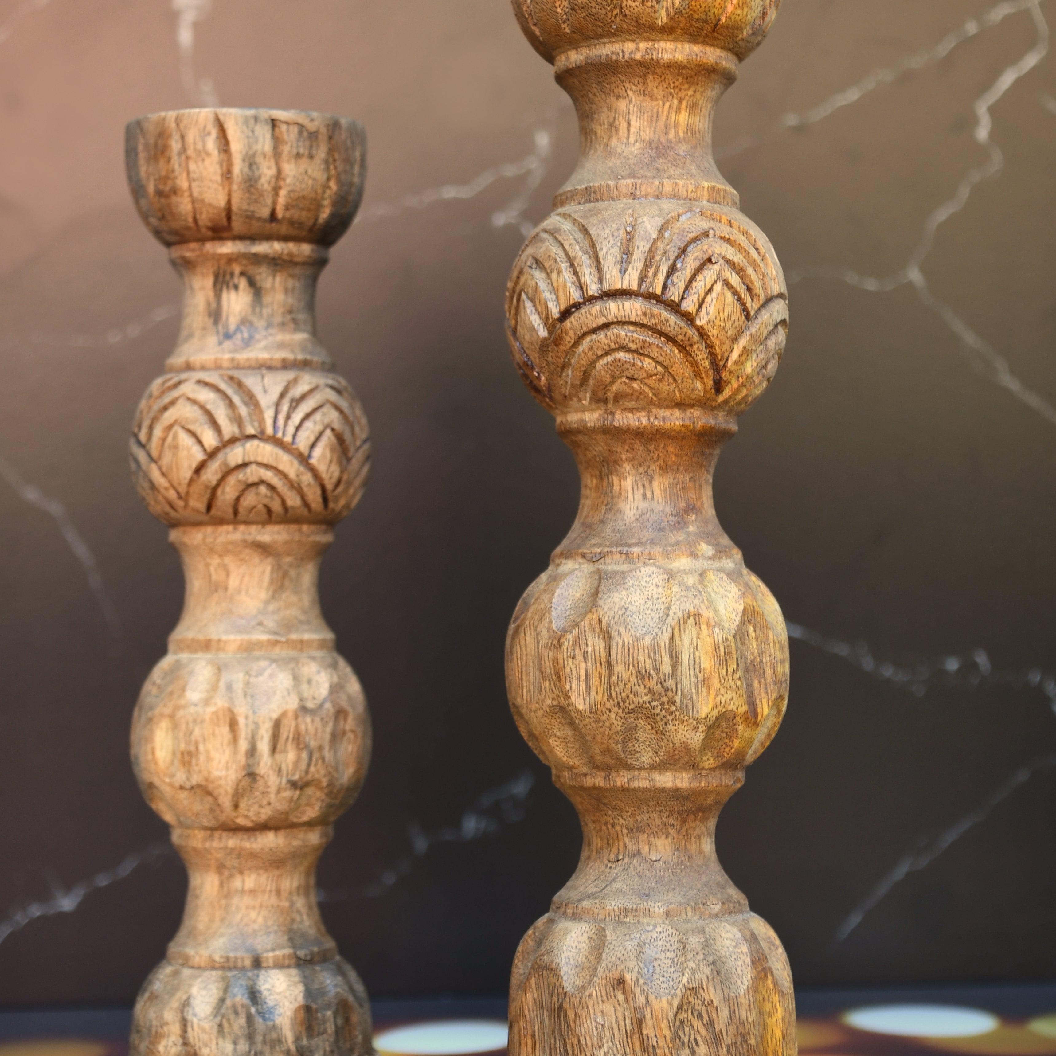 Wooden candle holder hand carved out of mango wood.