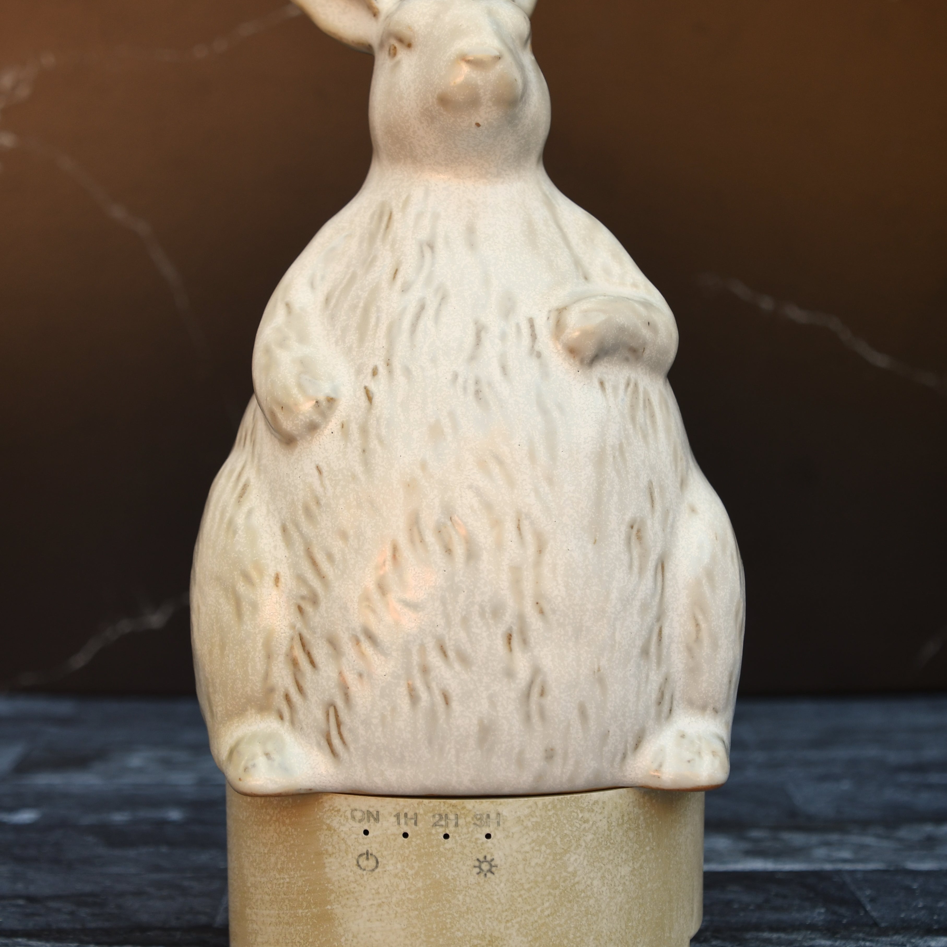 Stoneware rabbit shaped essential oil diffuser.