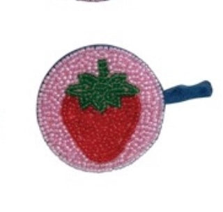 Strawberry-shaped tape measure with pink border on a white background
