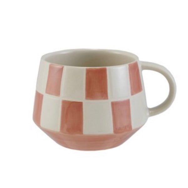 Ceramic mug with a checkered pattern on a white background