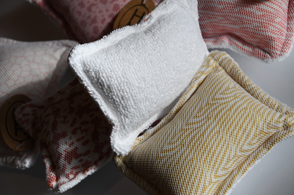 Three fabric items with different patterns on a light background
