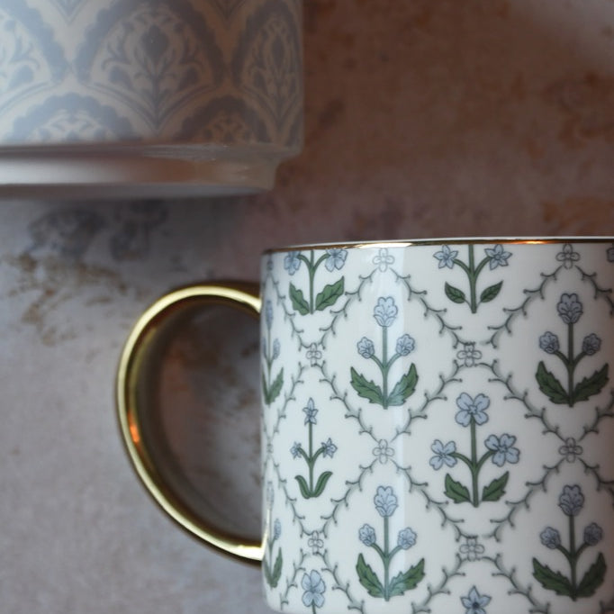 Patterned ceramic mug on a textured surface