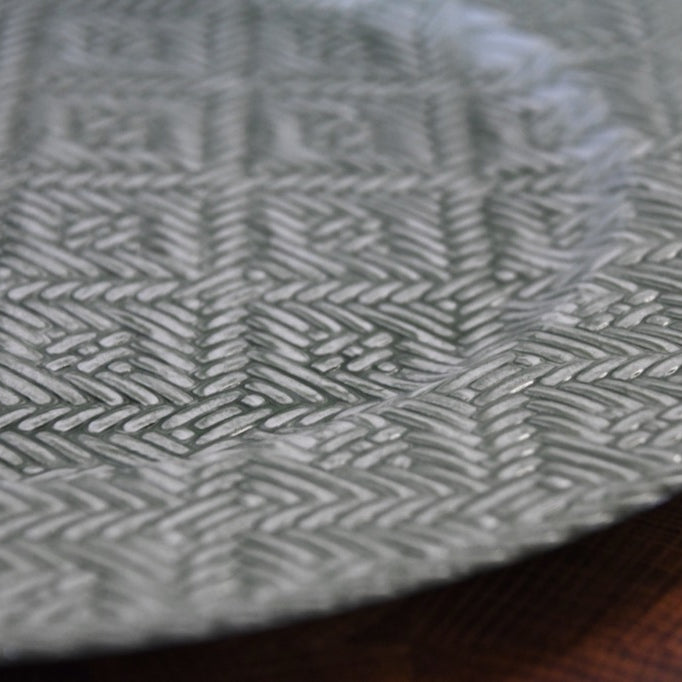 Close-up of a textured metal surface with a pattern