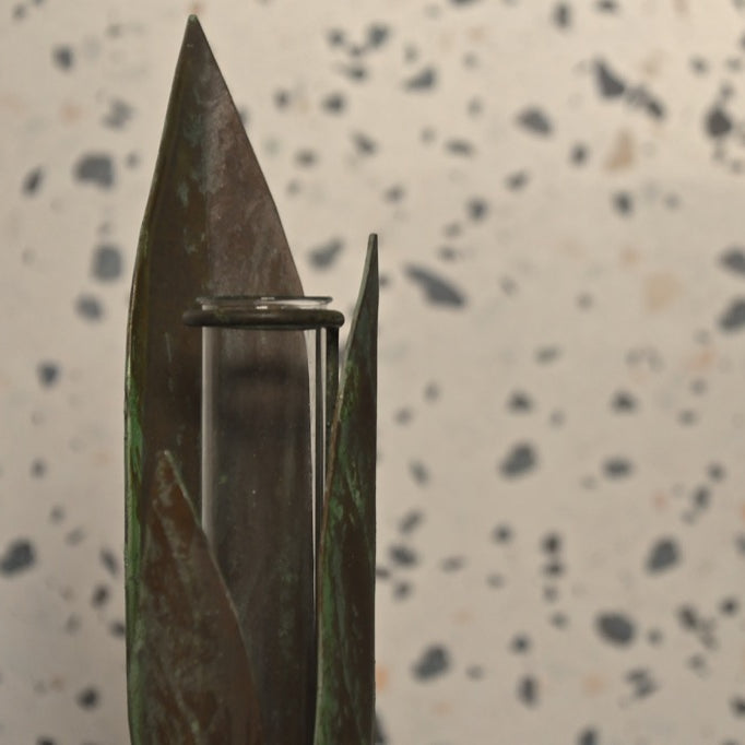 Knife blade with a metallic clip on a speckled surface