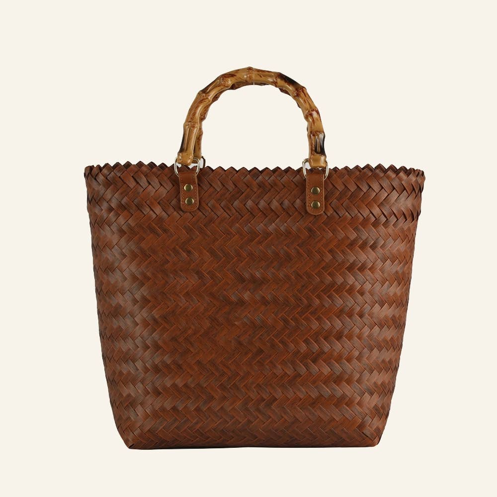 Brown basket weave tote bag with a bamboo handle. Made with 100% paper.