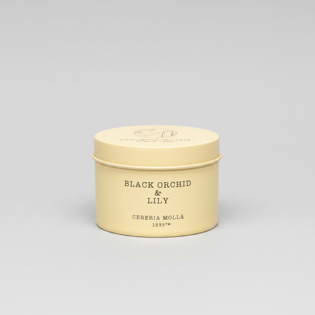 Beige candle tin labeled 'Black Orchid & Lily' by Cereria Molla on a white background