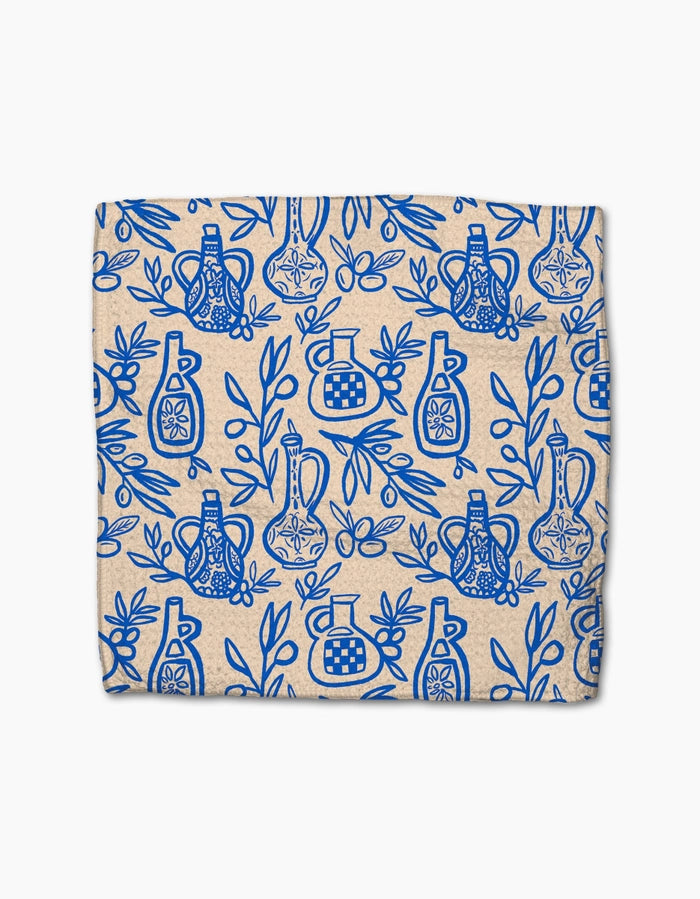 Patterned fabric with blue designs on a beige background