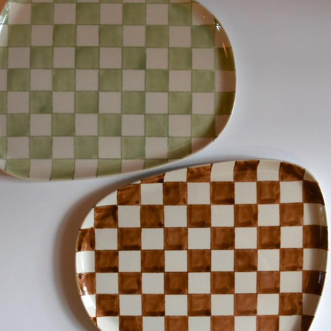 Two checkered ceramic plates on a white background