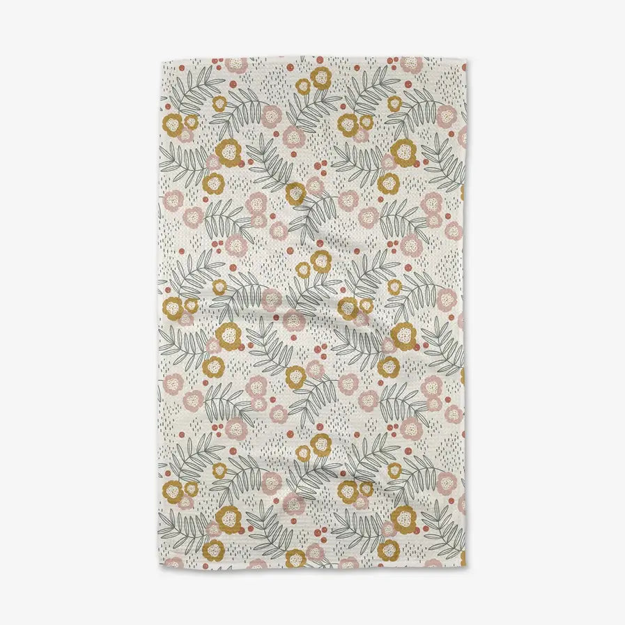 Floral patterned rug with flowers and leaves on a light background