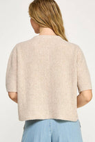 Beige button up the front sweater. 1/2 sleeve.
