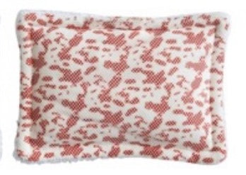 Rectangular sponge with red floral pattern on a white background