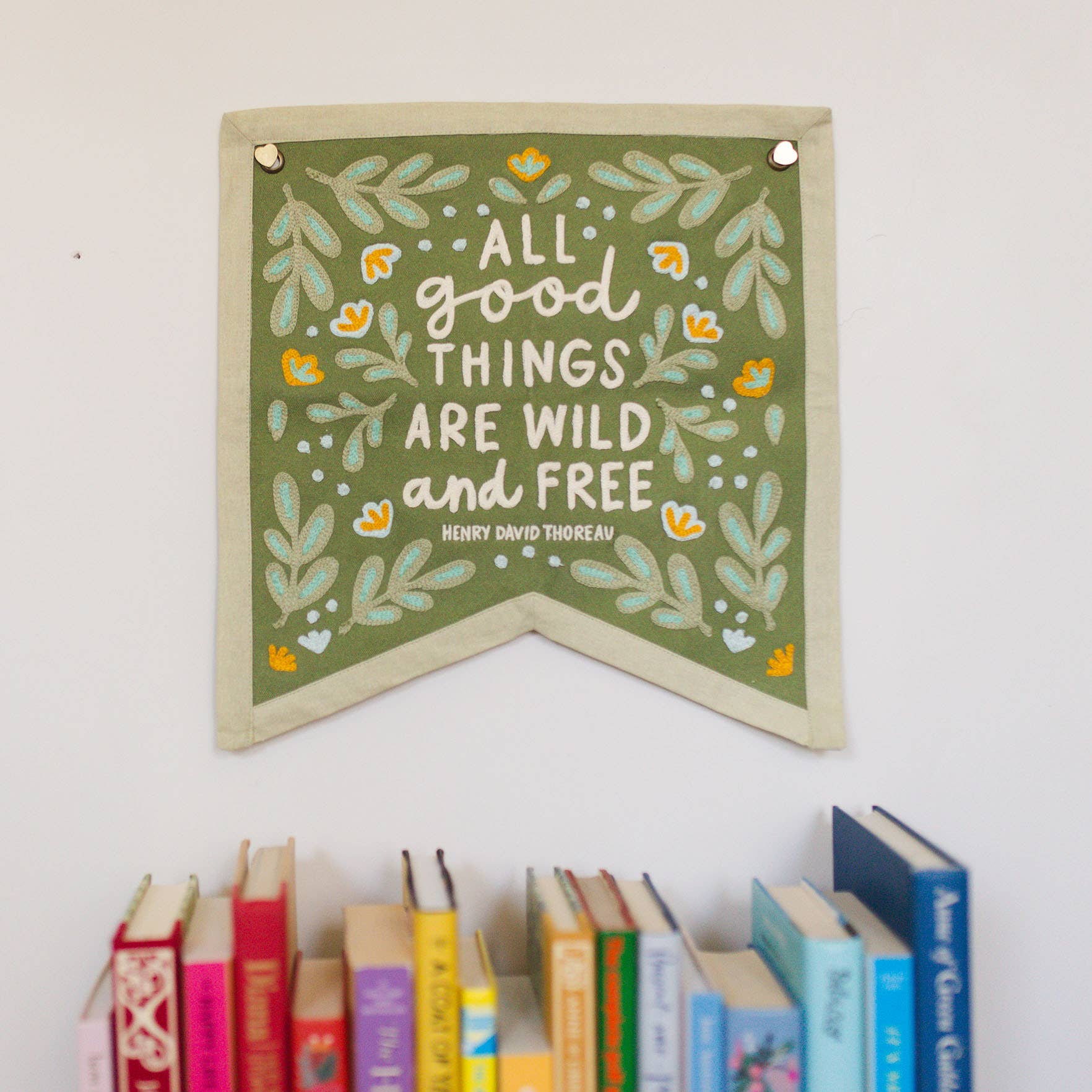 Canvas banner with Henry David Thoreau quote. All good things are wild and free