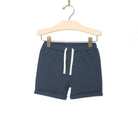 Indigo blue shorts with kangaroo pockets. White tie. Children's boy short.