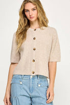 Beige button up the front sweater. 1/2 sleeve.