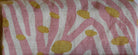 Fabric with pink and white striped pattern and yellow spots