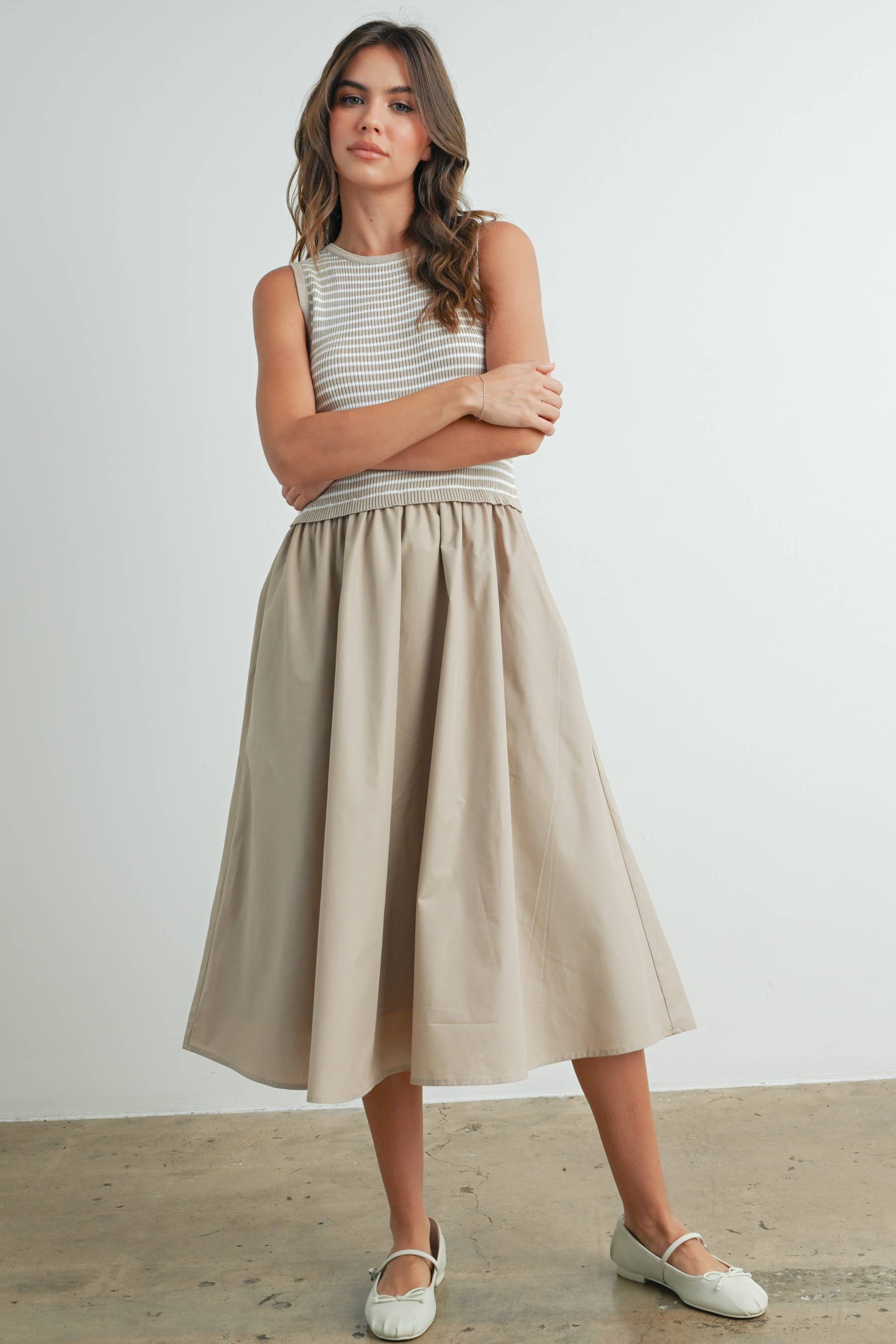 Beige, sleeveless midi dress with striped top.