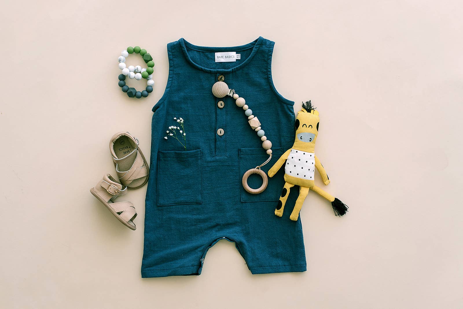 Toddler baby romber in navy blue with front pockets and buttons