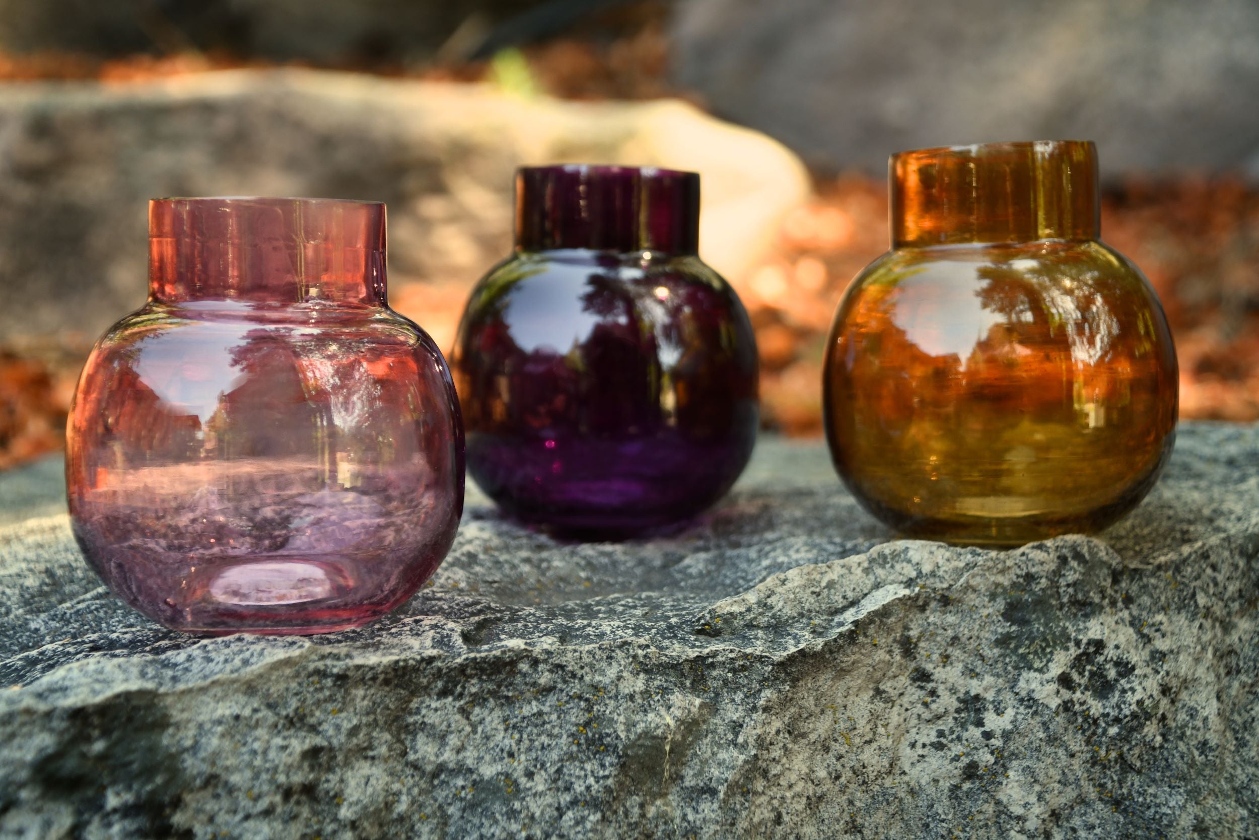 Small glass bud vase. Purple, amber or pink.