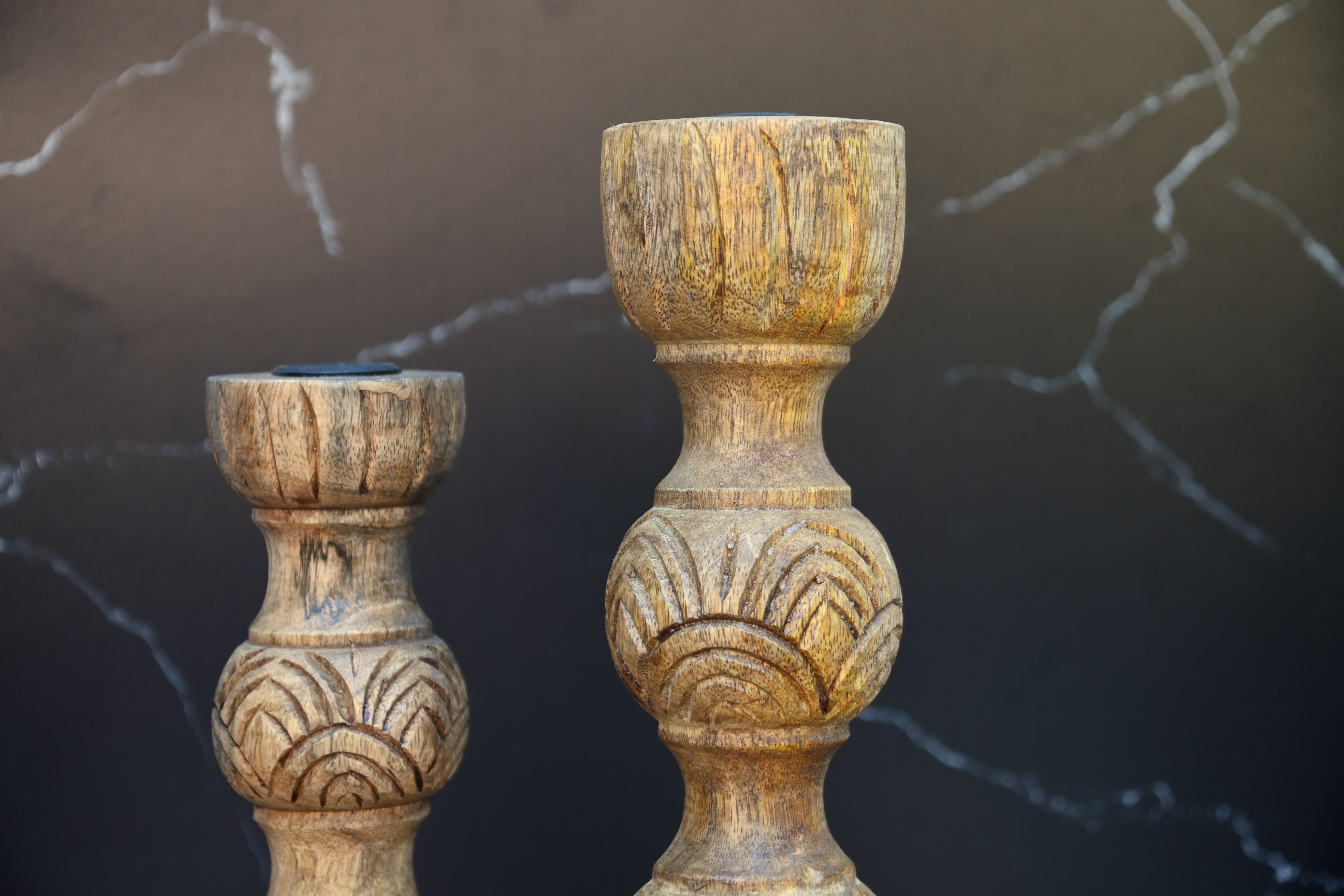 Wooden candle holder hand carved out of mango wood.