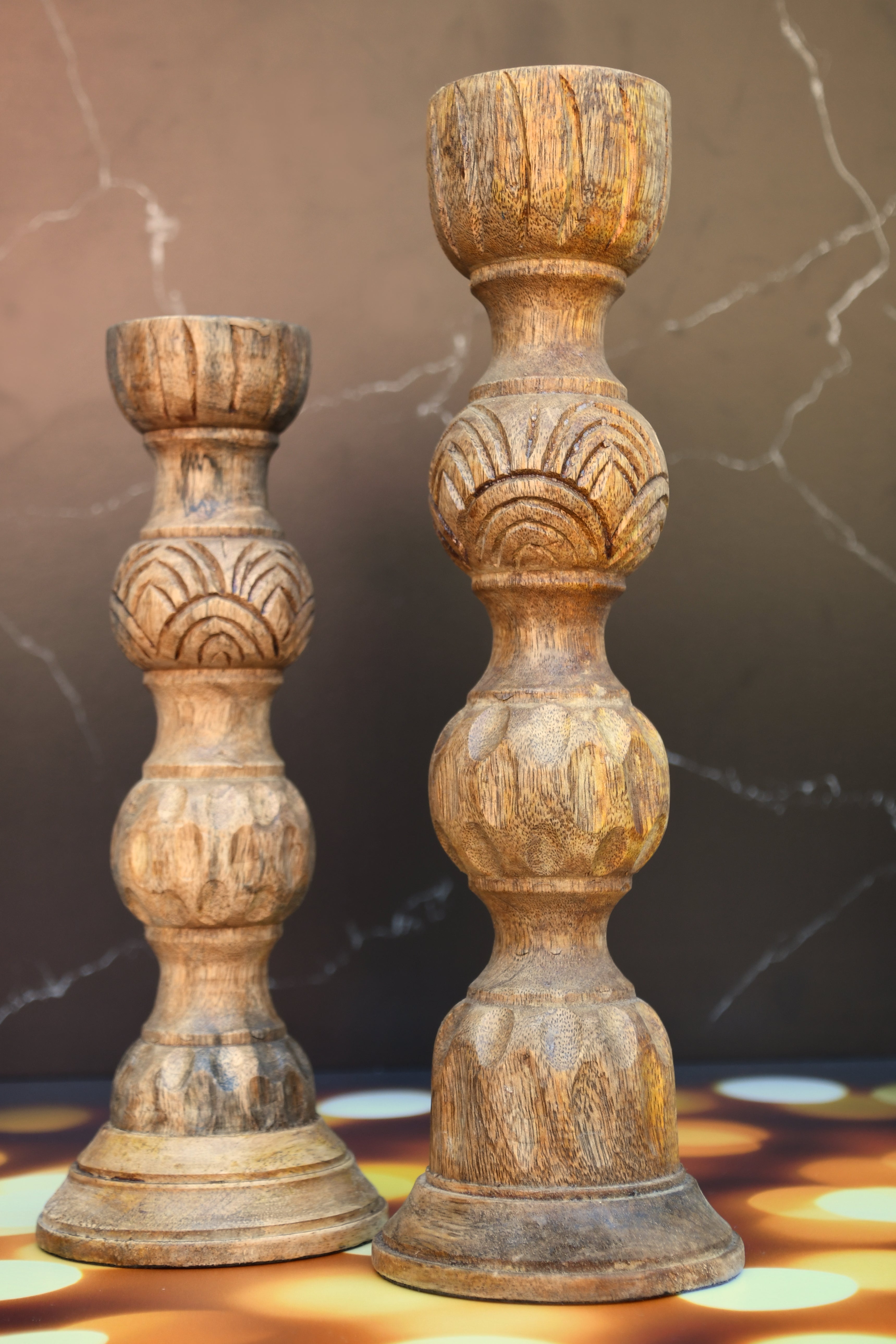 Wooden candle holder hand carved out of mango wood.