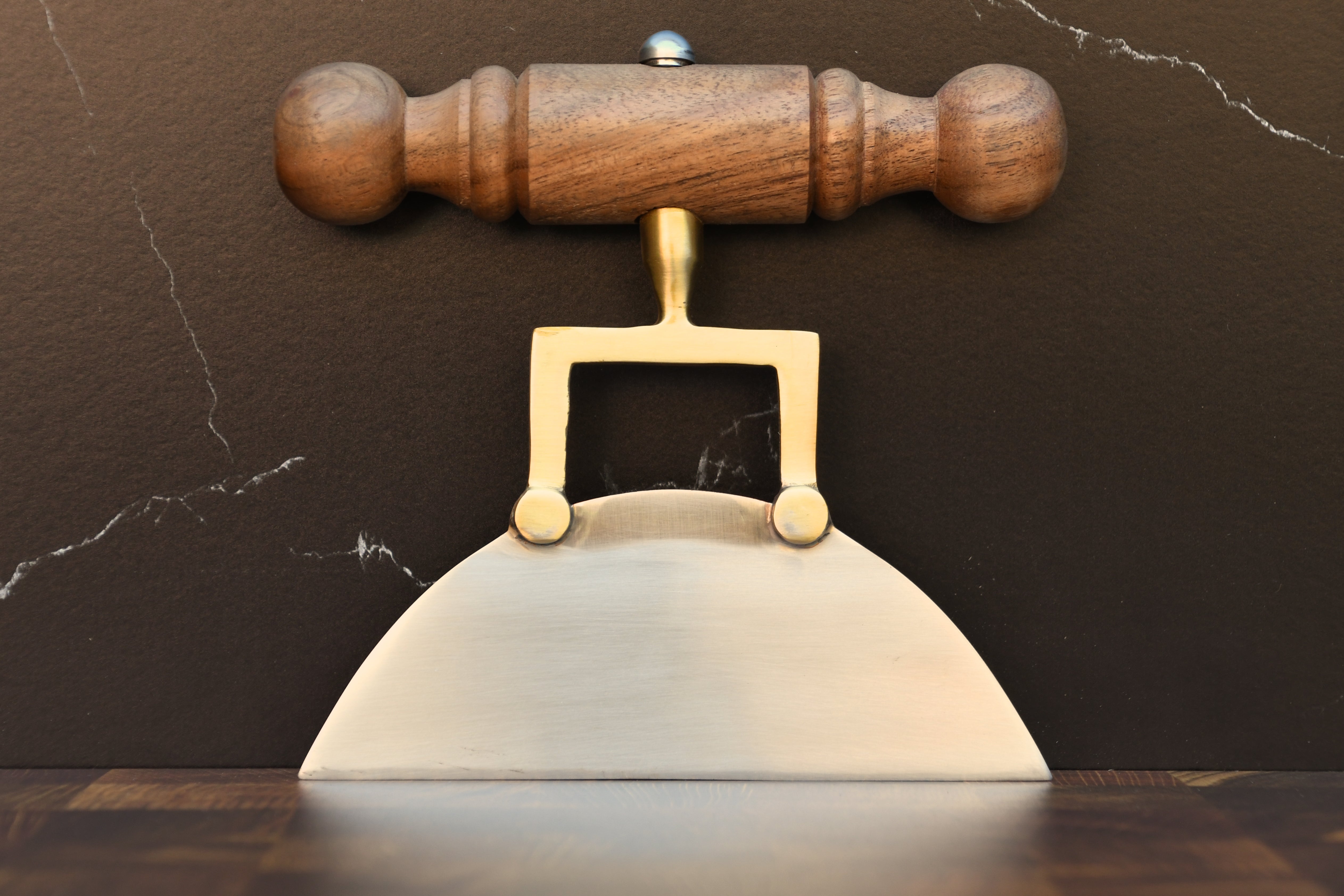 Wood handle stainless steel cheese knife.