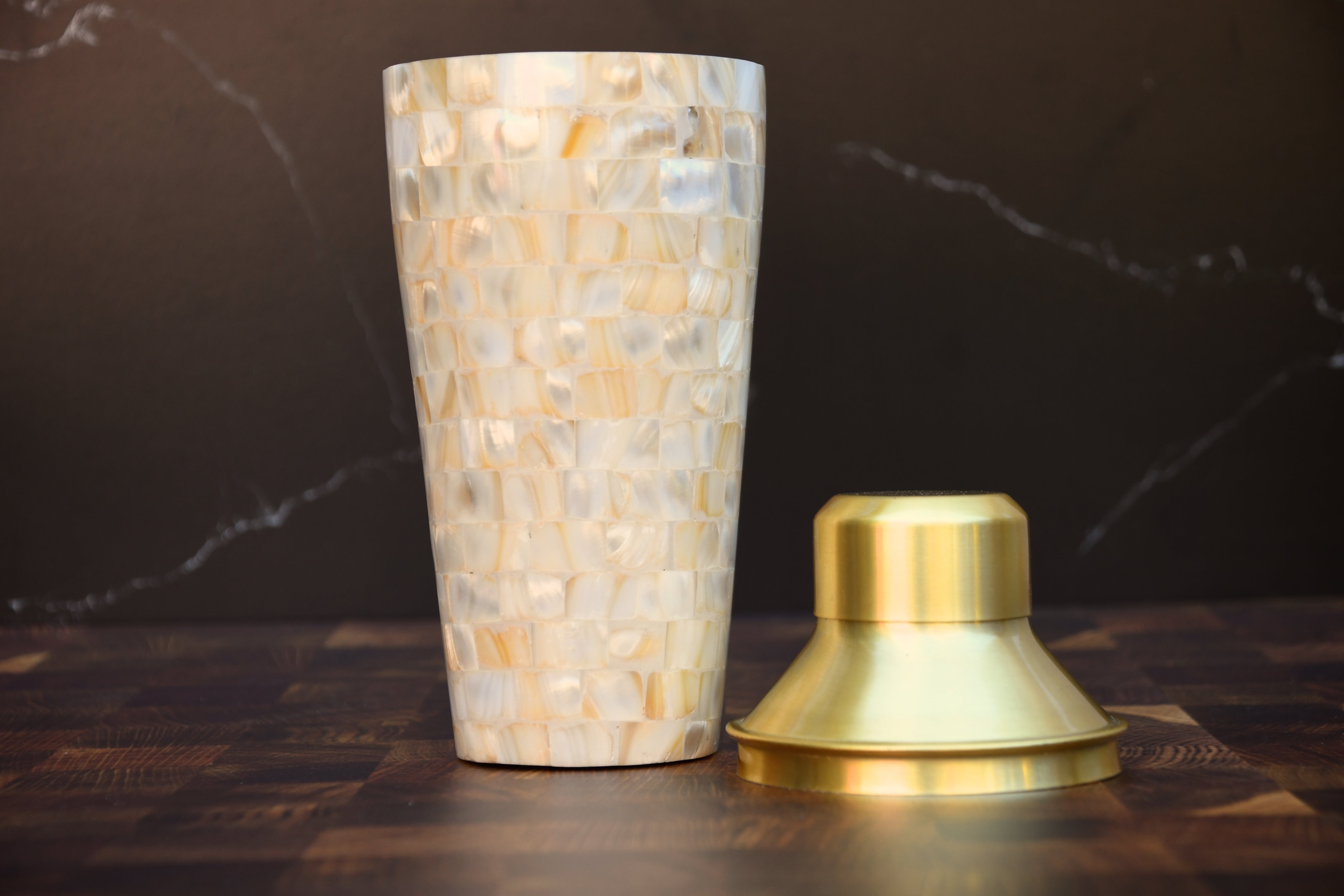 Stainless steel cocktail shaker with mother of pearl mosaic.