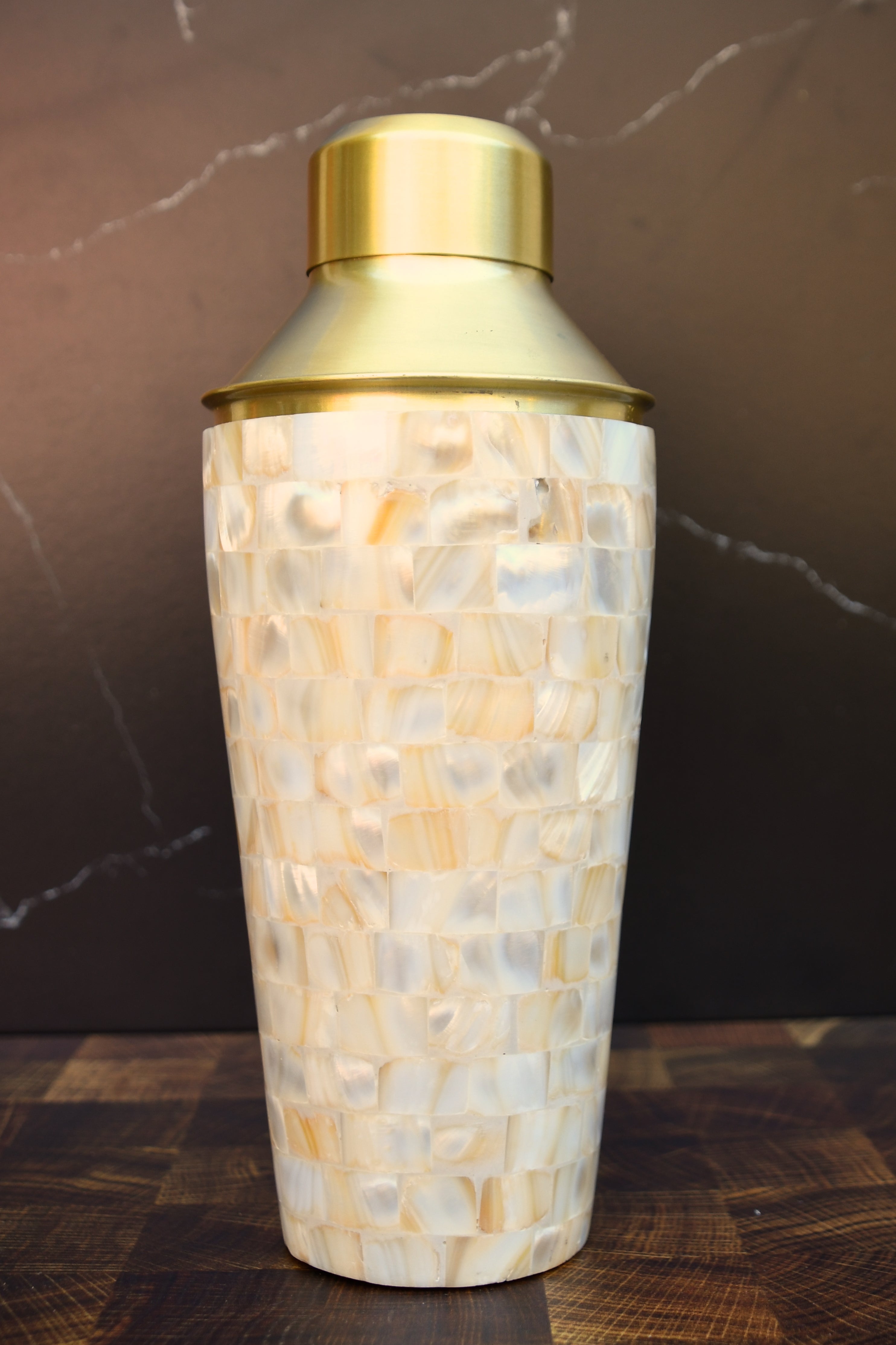 Stainless steel cocktail shaker with mother of pearl mosaic.