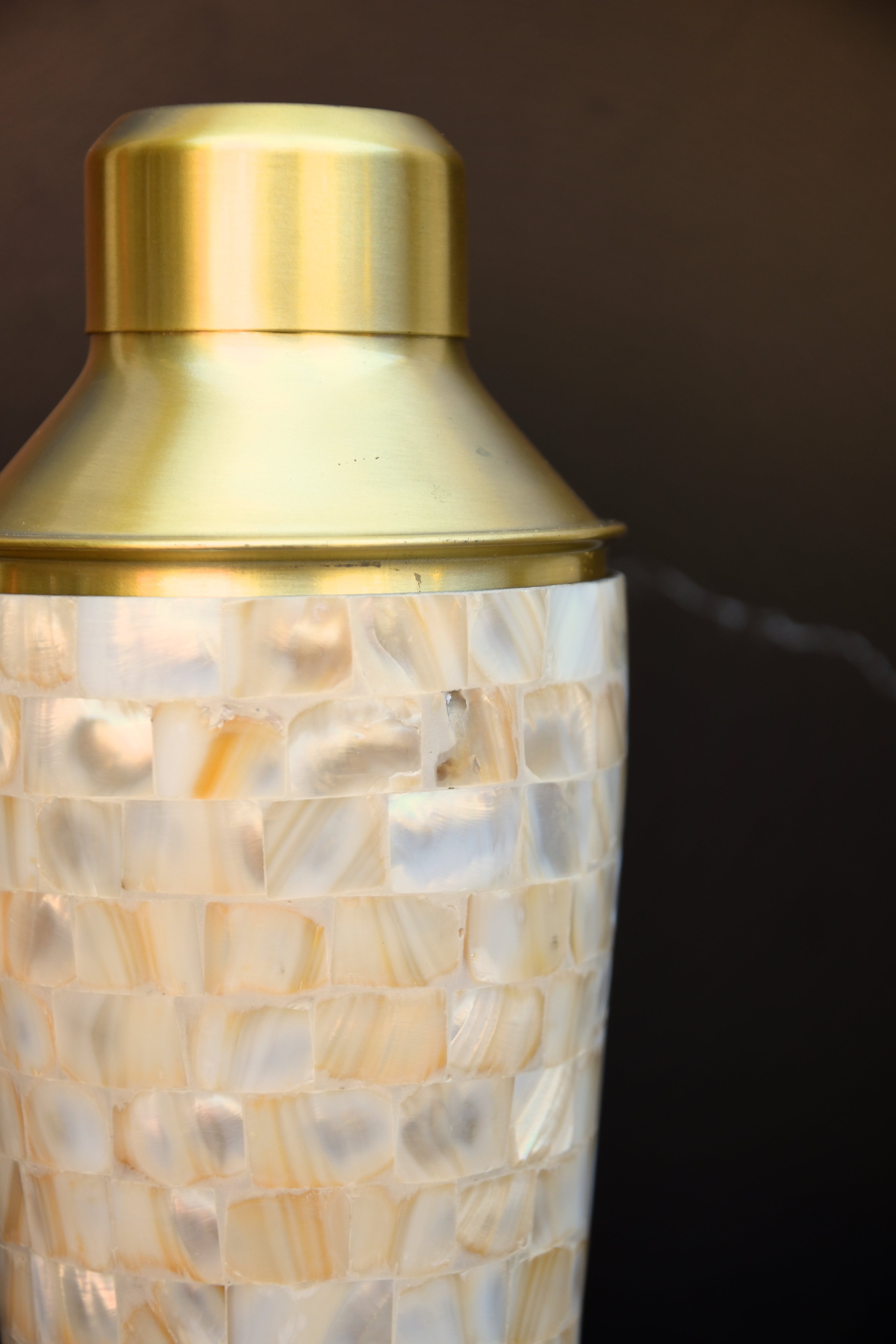 Stainless steel cocktail shaker with mother of pearl mosaic.