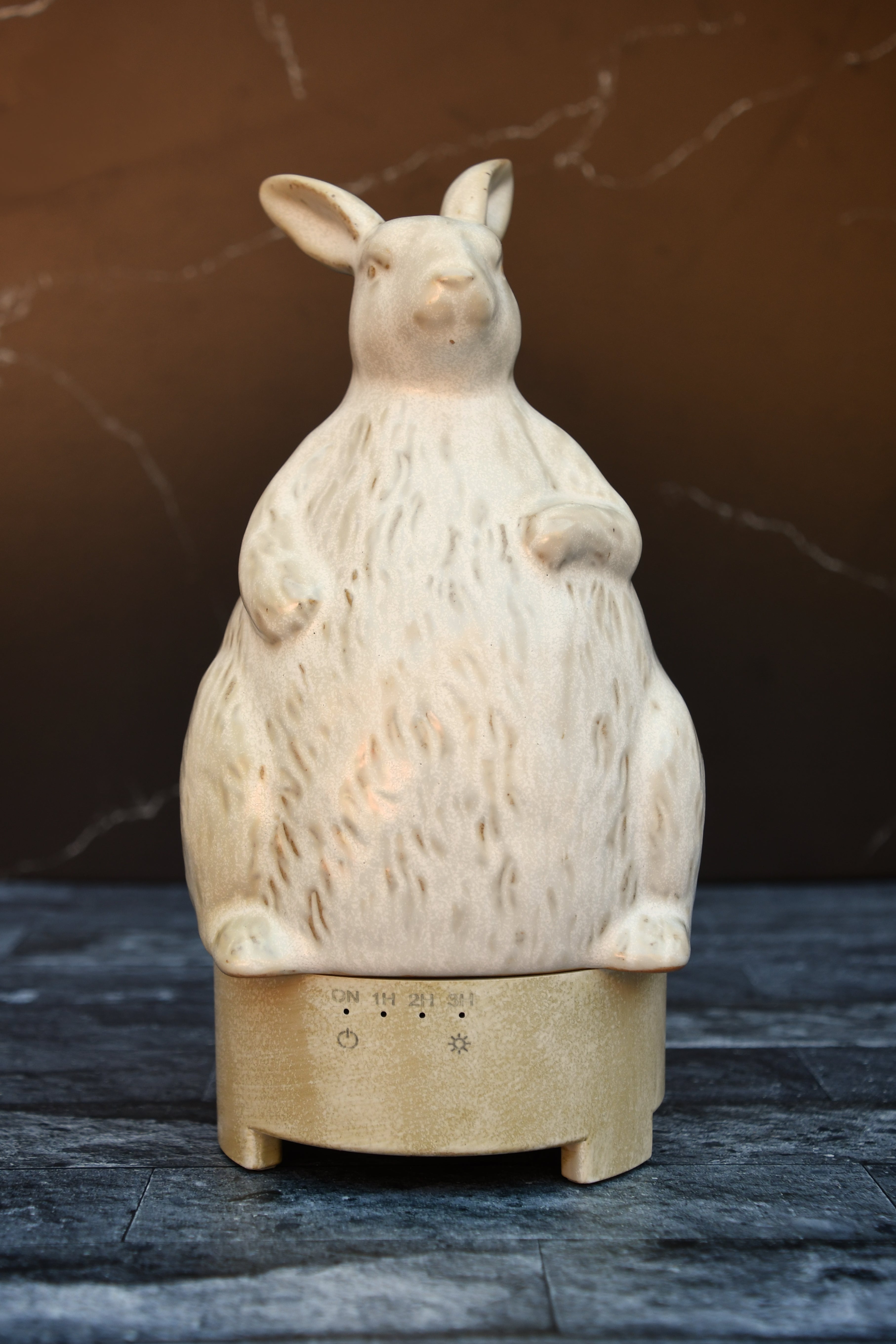 Stoneware rabbit shaped essential oil diffuser.