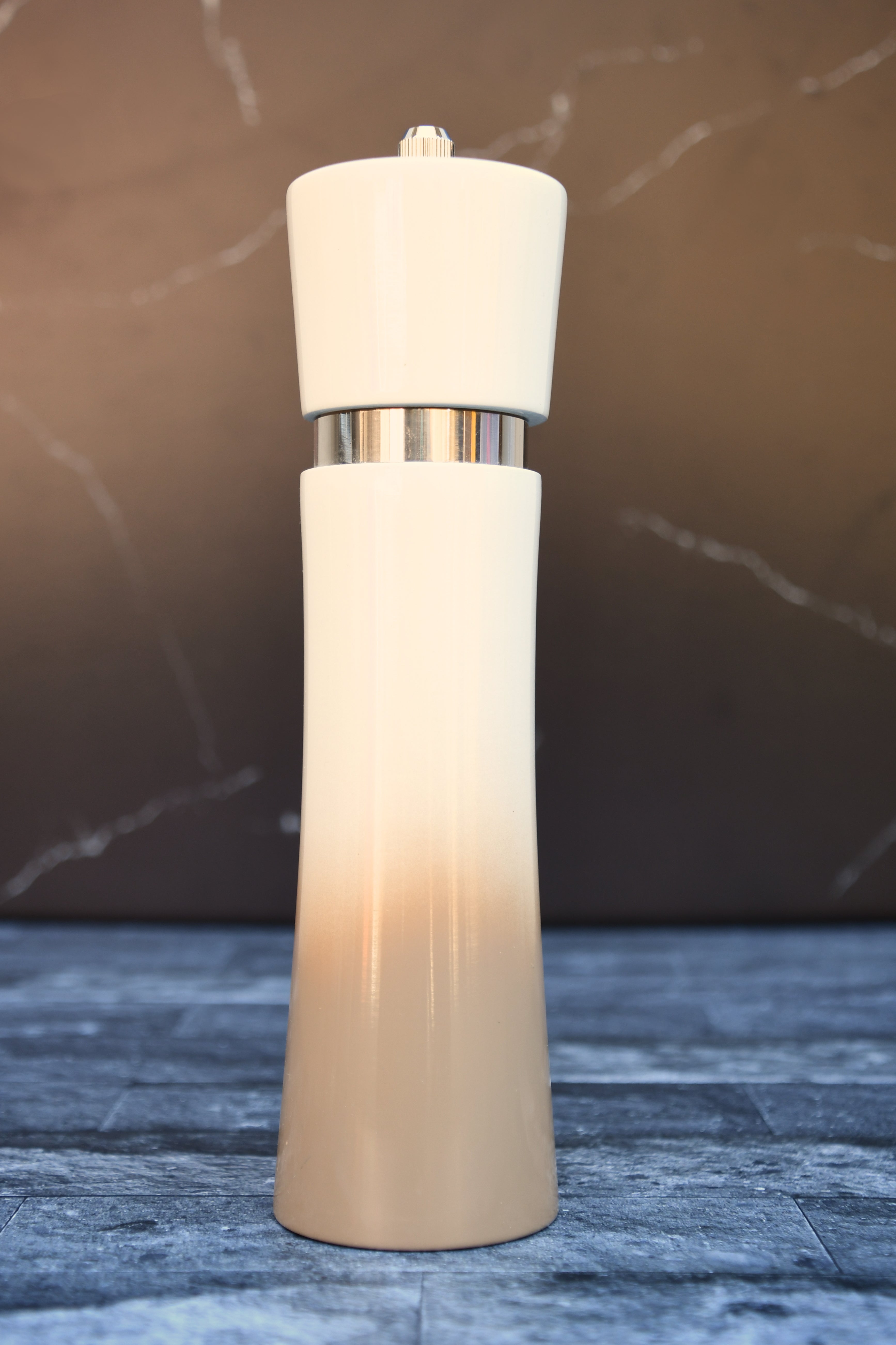 Tan and beige ombre salt and pepper mill.