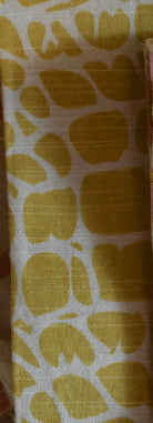 Fabric with yellow leaf pattern on a white background