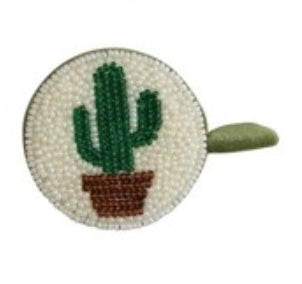 Circular beaded accessory with a cactus design on a white background