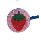 Strawberry-shaped tape measure with pink border on a white background