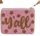 Pink pouch with gold 'Y'all' text and star patterns on a white background