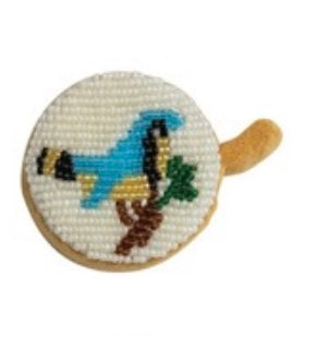 Small round beaded item with a blue bird design on a white background