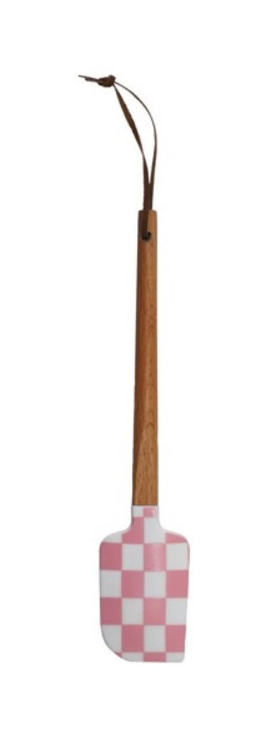 Checkered spatula with wooden handle on a white background