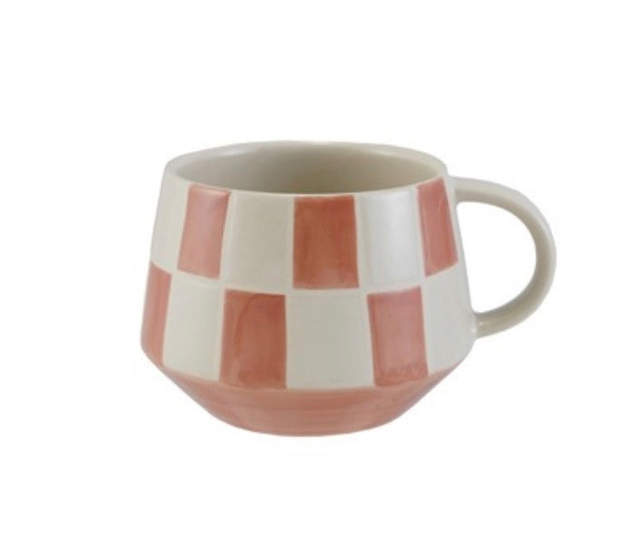 Ceramic mug with a checkered pattern on a white background