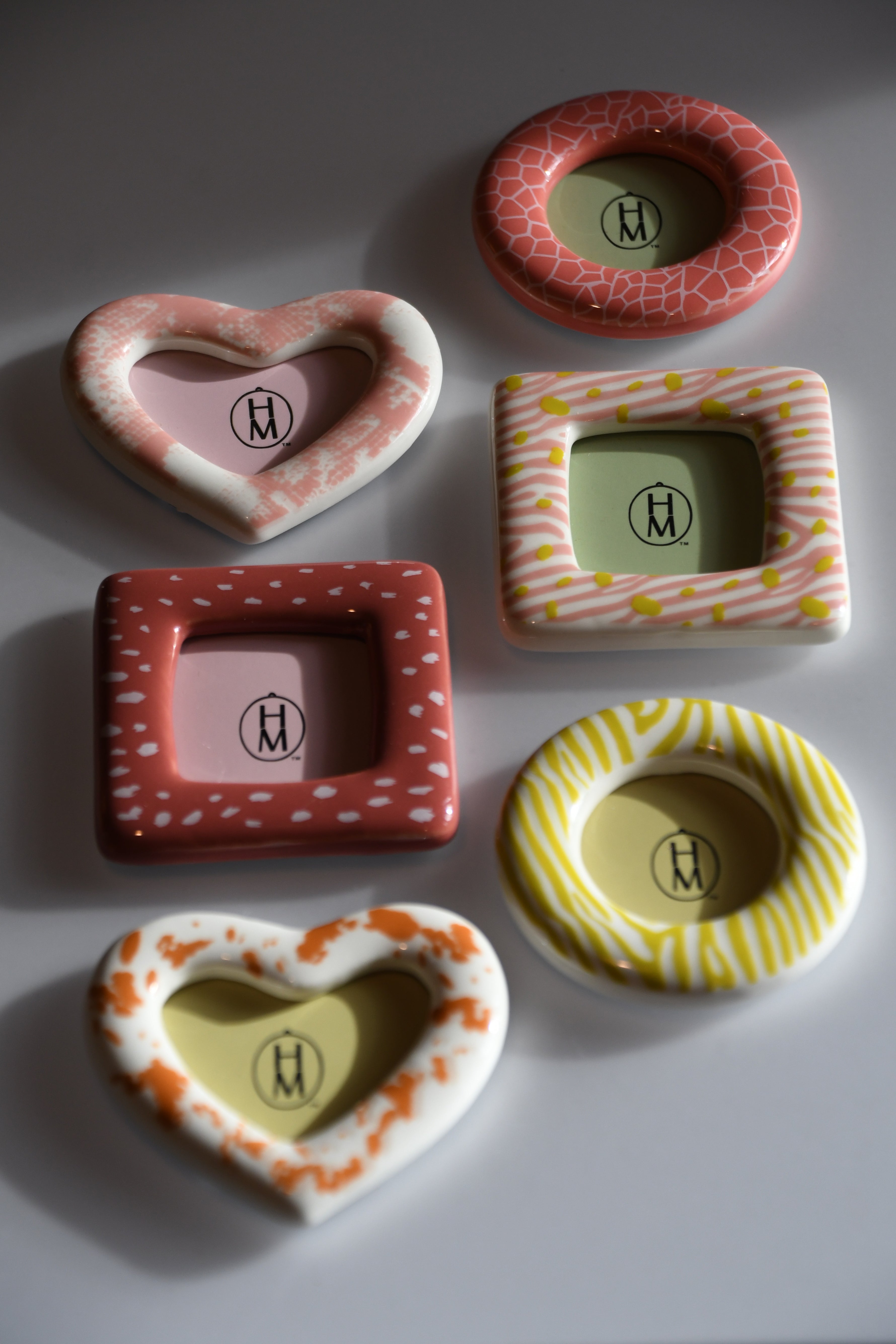 Set of colorful ceramic frames on a white background