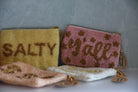 Two pouches with text 'SALTY' and 'tjall' on a gray background