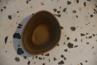 Ceramic bowl on a speckled surface