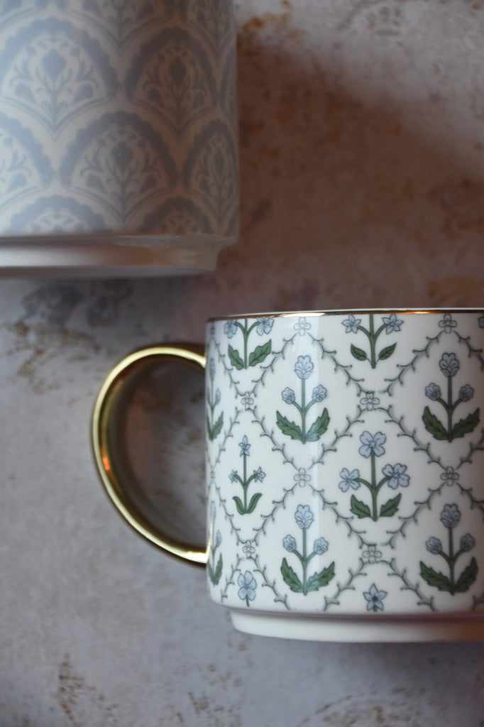 Patterned ceramic mug on a textured surface
