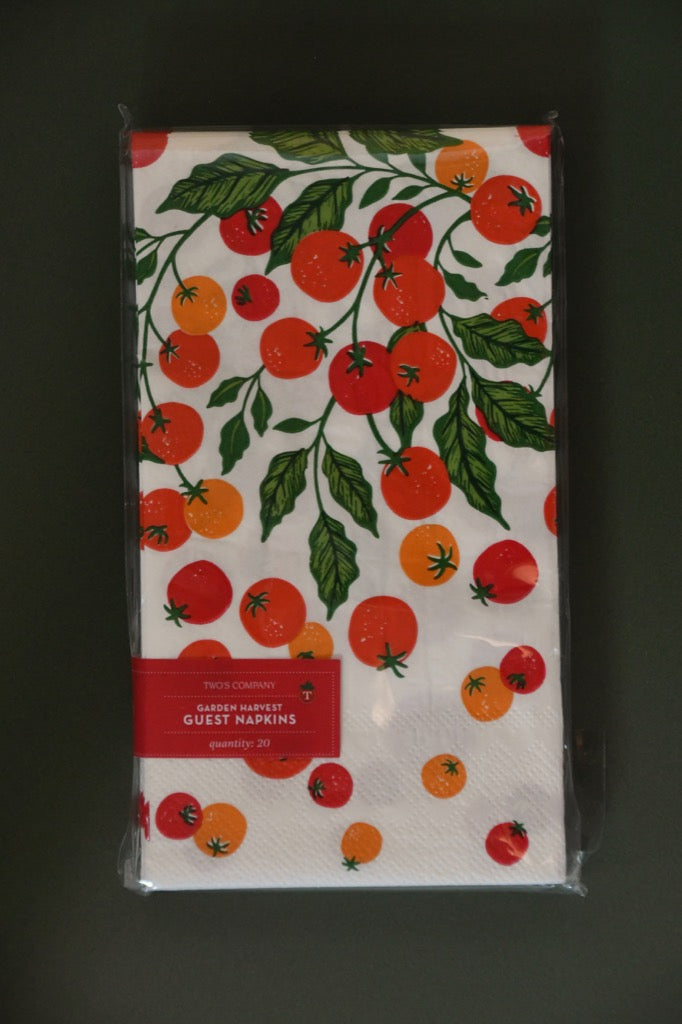 Pack of paper napkins with tomato design on a dark background