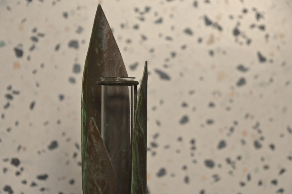 Knife blade with a metallic clip on a speckled surface