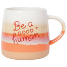 Orange and white ombre mug with "Be a good human" print. 