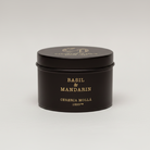 Black tin container with gold text on a white background