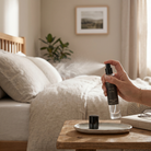 Person holding a diffuser bottle in a living room setting