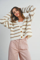 Ivory, V neck, button front cardigan with beige stripes and long sleeves.